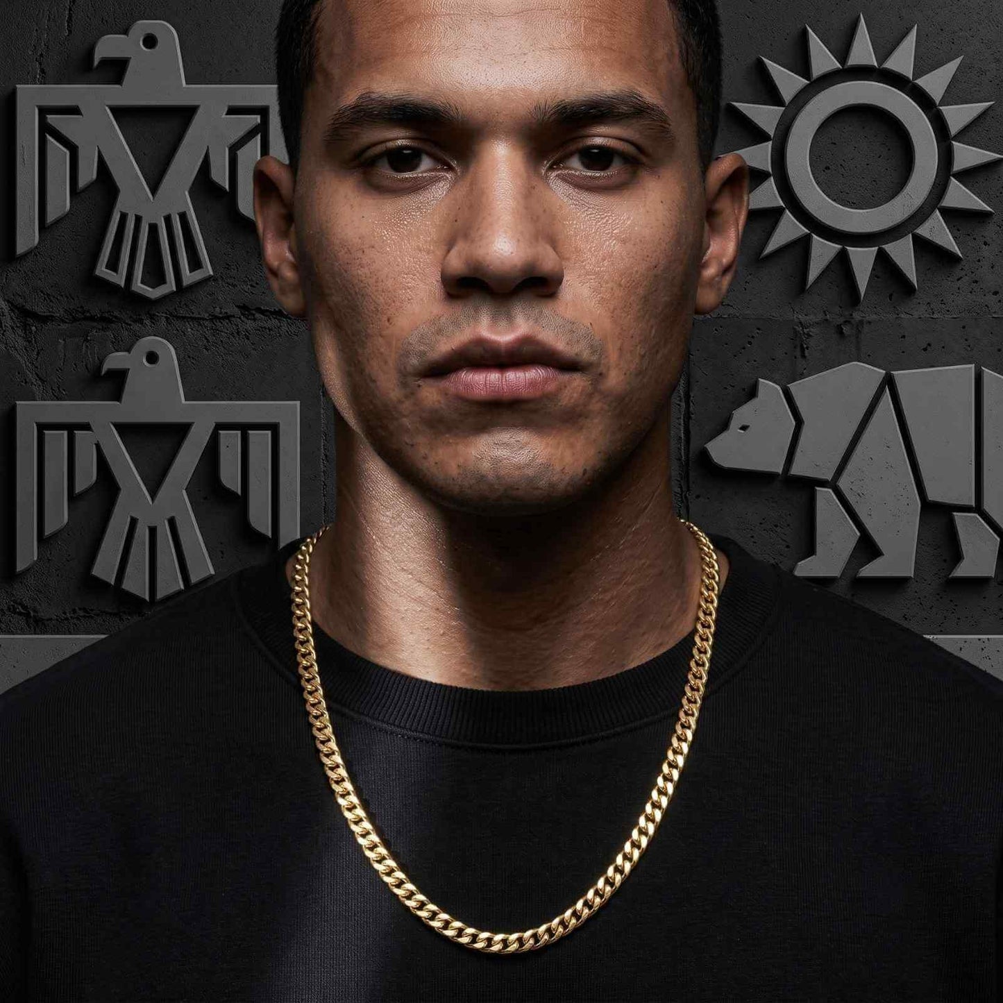 Close-up portrait of a male model wearing the iceX 9mm gold Miami Cuban chain over a black sweatshirt.